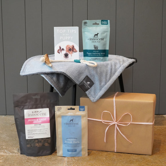 Innocent Hound puppy gift box containing airdried dog treats and food